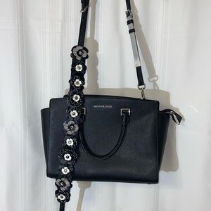 Michael Kors large black hand bag with flower crossbody strap